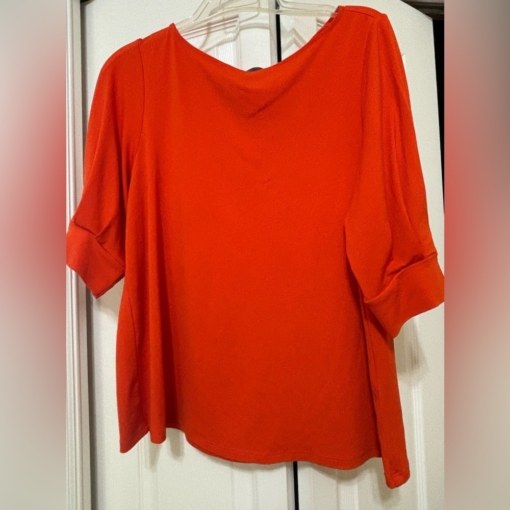 Burnt orange bold statement blouse with cuffed pleated sleeves